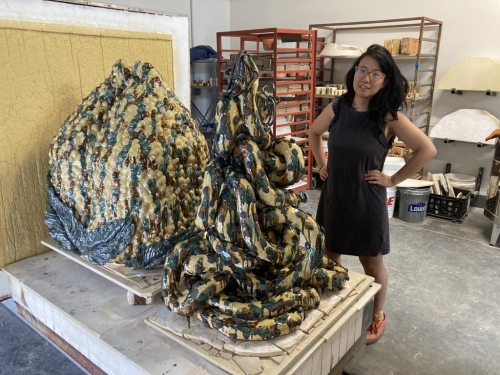 Cathy Lu at Archie Bray, with her sculptures,&nbsp;Untitled (Tall Peach Incense Holder) and&nbsp;Nuwa&#39;s Hands,&nbsp;2021.