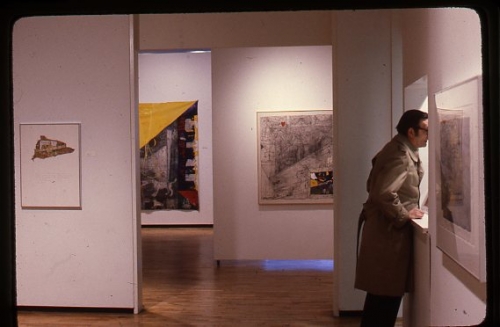 Critic Ted Wolff visiting the gallery to view the 1981 William T. Wiley exhibition at Allan Frumkin Gallery, New York. Installed behind him, l-r: Magabark, 1981; Bad Balance II: Freedumb and Ridicule, 1981; Still Life for Atlantic, 1981; and to his right, Scam Quentin, 1981.

Image courtesy the George Adams Gallery archives.